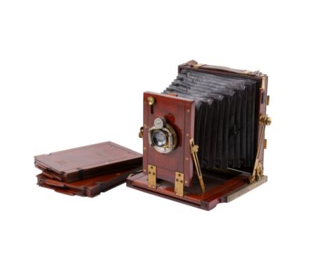 An antique brass and mahogany H. Park half-plate camera. With a Beck-Steinheil lens, working Bausch & Lomb shutter, ground gl