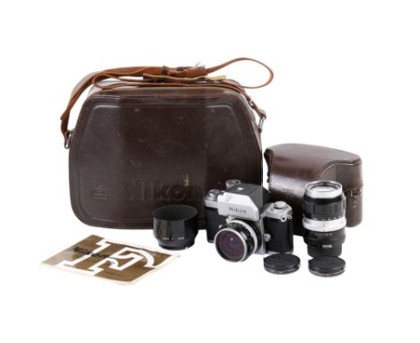 A Nikon F Photomic T 35mm SLR camera outfit. Chrome. Serial number 6772455. With two lenses; a Nikkor-H Auto 28mm f3.5, and a