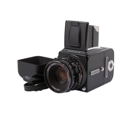 A Hasselblad 500 C/M 6 x 6 Medium Format SLR camera. 1988. Black. Serial number RR 1421182. With a Carl Zeiss 80mm f2.8 Plana