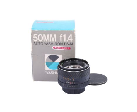 A Yashica 50mm f1.4 Auto Yashinon DS-M lens. M42 screw mount. With front and rear caps and makers box. Rubber focus grip is l