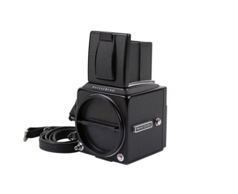 A Hasselblad 500 C/M 6 x 6 Medium Format SLR camera body. 1987. Black. Serial number RU 1413138. With front and rear caps, WL