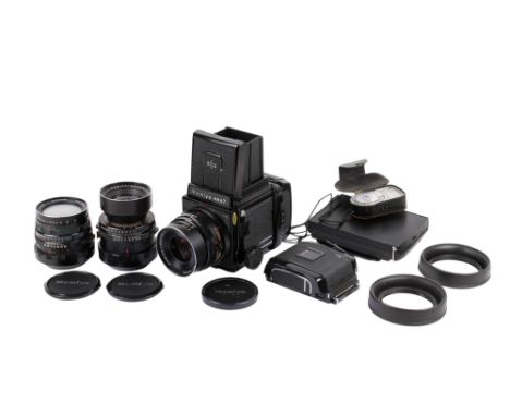 A Mamiya RB67 Professional 6 x 7 Medium Format SLR camera outfit. Serial number C228642. With three lenses; a Mamiya-Sekor 50