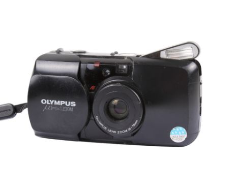 An Olympus MJU Zoom 35mm compact camera. Black. Serial number 6469761. With an Olympus 35-70mm zoom lens and instruction manu