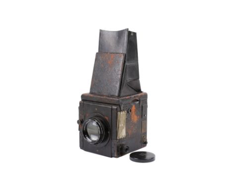 An unbranded reflex plate camera. Makers plate appears to have been removed. With a Dallmeyer 7 inch f2.9 Pentac lens, serial