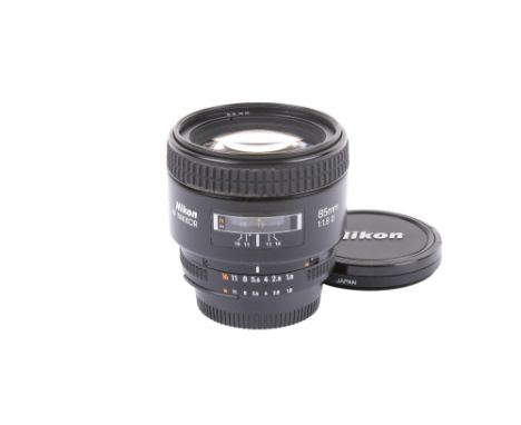 A Nikon AF Nikkor 85mm f1.8 D lens. With Skylight(1B) filter, front and rear caps. VG optical and cosmetic condition. Appears