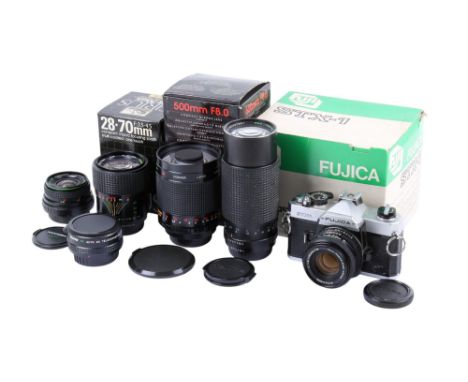 A Fujica STX-1 35mm SLR camera outfit. Chrome. Serial number 4542555. With five lenses; a Fuji 50mm f1.9 X-Fujinon, a Hanimex