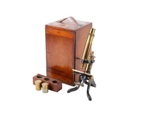 A Henry Crouch London brass monocular microscope. Serial number 8596. With No.40 viewing lens, one objective lens numbered 19
