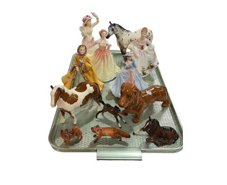 Seven Beswick pieces, four Royal Doulton and one Worcester figure (12).