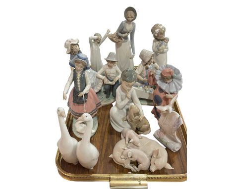 Four Lladro groups and advert, and six Nao and other figures (11).