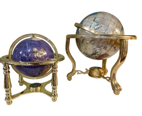 Two semi-precious stone and brass bound globes with compass bases.