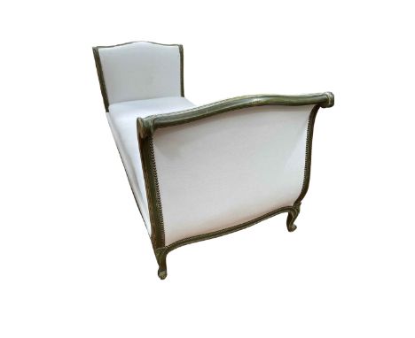 Green and gilt painted double scroll end day bed in light studded fabric, 212cm.