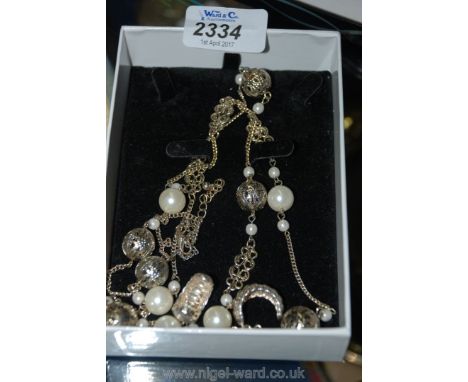 A pair of 925 Silver Earrings and a Necklace