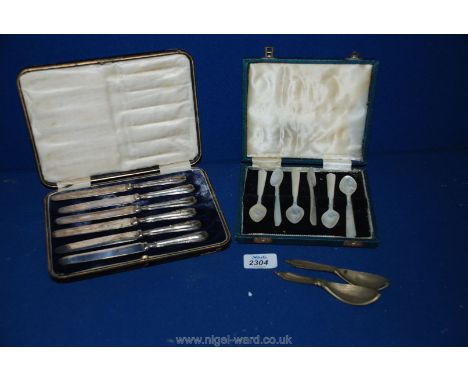 A box of Silver plated butter Knives, six boxed Mother of pearl Spoons and two small scoop spoons