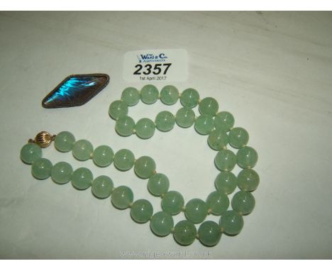 A polished Agate Necklace with 9ct gold clasp and a Silver butterfly wing Brooch