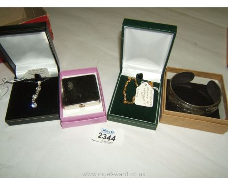 A Necklace and Bracelet set, 'Coty' of Paris Compact, three stone Solitaire Pendant and chain with P.T.H.M. and a silver colo