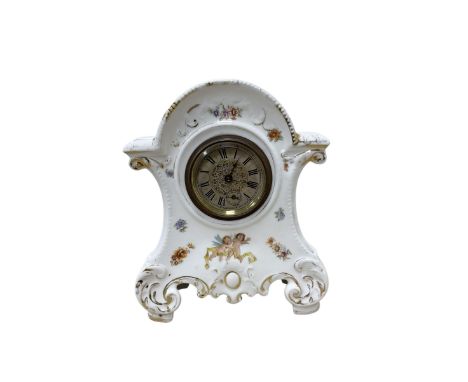 German-Porcelain 8-day spring driven timepiece mantle clock with cherub transfer decoration, wound and set from the rear.