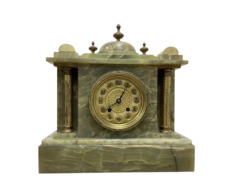 French-early 20th century 8-day onyx mantle clock with a gilt metal dial and rack striking movement.