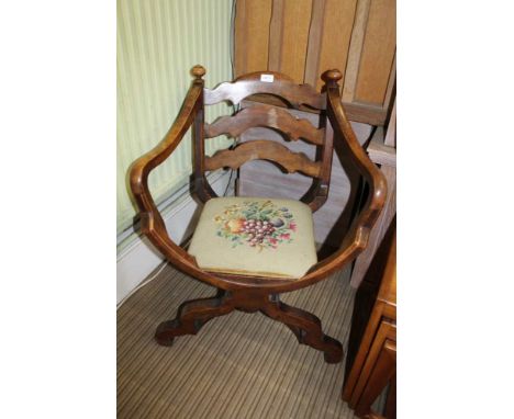 A 19TH CENTURY CONTINENTAL FRUITWOOD CROSS FRAME OPEN ARMCHAIR, wavy ladder back with turned finials, drop-in upholstered sea