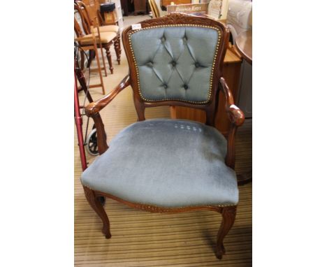 A MODERN REPRODUCTION FRENCH DESIGN SHOW WOOD FRAMED ARMCHAIR, with compliant blue upholstered button back pad and seat 