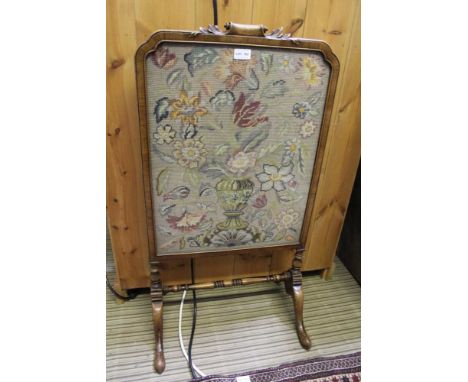 AN EARLY 20TH CENTURY MAHOGANY FRAMED FIRE SCREEN scroll and acanthus leaf crest, on cabriole trestle feet, inset a woolwork 