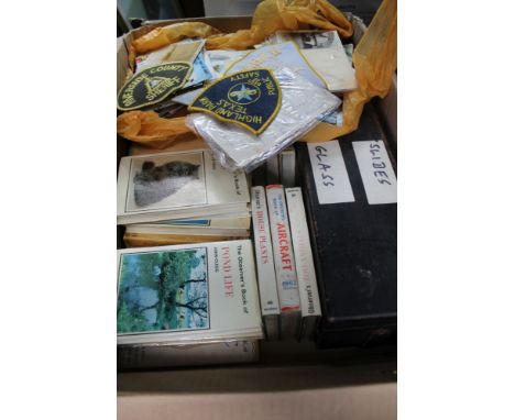 A BOX CONTAINING A LARGE SELECTION OF COLLECTABLE EPHEMERA, to include; magic lantern slides, postcards, badges, etc. 