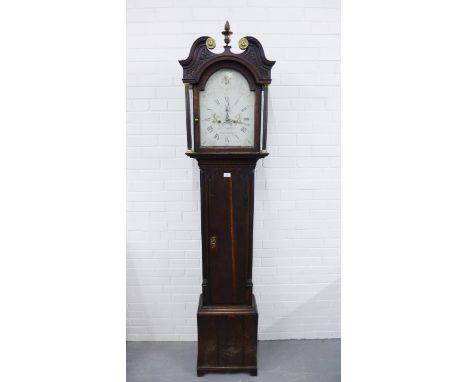 A 19th century oak cased longcase clock, the domed top with broken swan neck pediment above a painted dial with Roman numeral