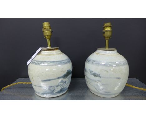 A pair of Chinese blue and white pottery table lamp bases, 26cm high