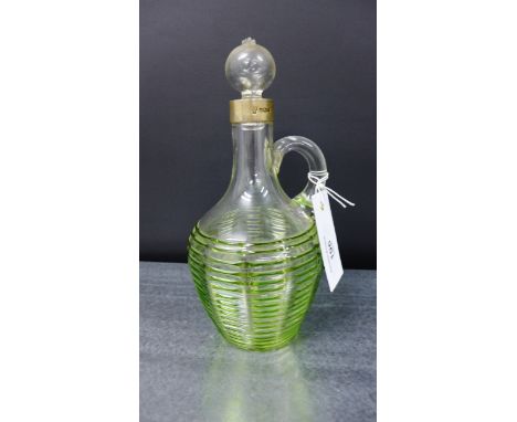 Edwardian clear glass decanter / jug in the manner of James Powell for Whitefriars, with green glass spiral trails to the bod