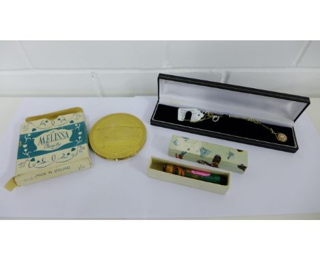 A mixed lot to include a vintage powder compact, novelty fountain pen and a millefiore glass pendant on chain (3) 
