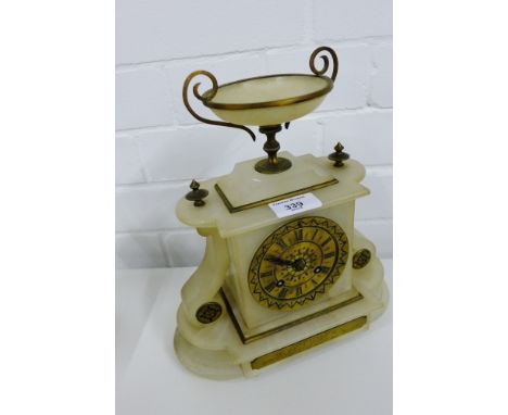 A hardstone mantle clock, the brass dial with Roman numerals 25 x 30 cm 