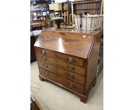 George III Mahogany Bureau, the fall front opening to a fitted interior, four long drawers and raised on bracket feet, 107cm 
