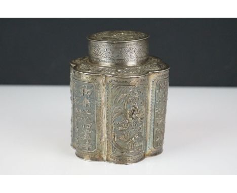 An antique ornate Chinese silver tea caddy with Repoussé decoration, character marks to base. 