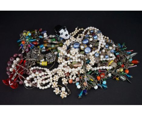 A collection of vintage and contemporary costume jewellery to include beaded necklaces and a Lea Stein style brooch. 