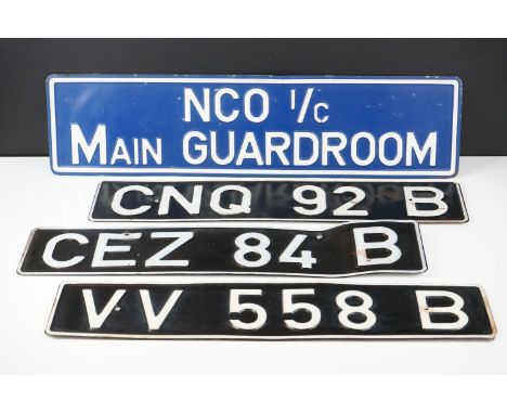 Three Vintage vehicle metal number plates together with a metal guardroom sign, reads ' NCO I/C Main Guardroom', approx 60cm 