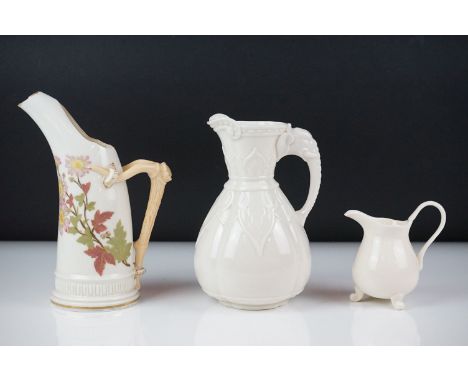 Royal Worcester blush ivory tusk-shaped jug painted with flowers, with gilt borders, 19cm high, together with an off-white po