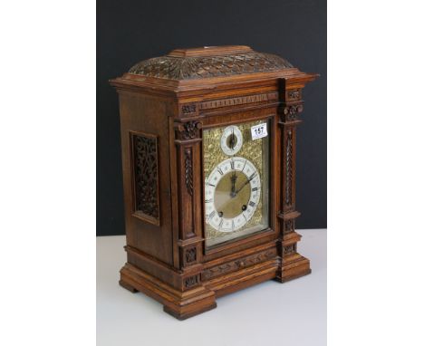 Late 19th / Early 20th Century Lenzkirch carved oak bracket clock, the brass dial with silvered chapter ring below a subsidia