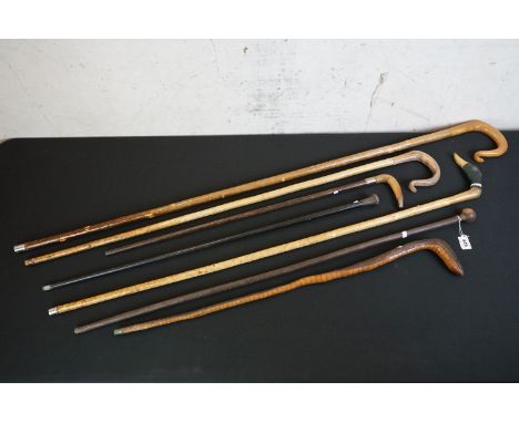 Three Shepherd's Crooks with horn handles, one carved in the form of a Duck, together with African Hardwood Walking Stick wit
