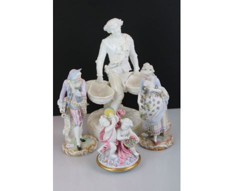 Pair of Chelsea style porcelain figures in 18th century dress with floral and gilt decoration, to include a young man carryin