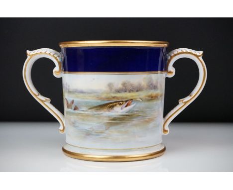Early 20th Century Royal Worcester loving cup, dated 1921, with hand painted Pike and floral decoration, gilt edges and folia