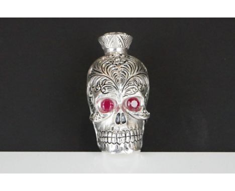 Unusual skull shaped lidded flask with glass eyes 