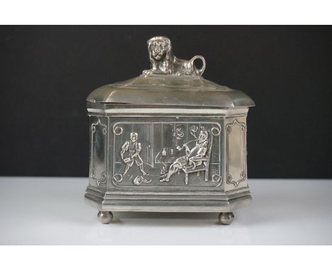 A.E. Williams pewter tea caddy of octagonal form with relief panel decoration depicting a tavern scene, the stepped lid with 
