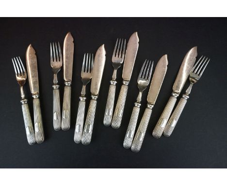 A silver plated fish knife and fork set. 