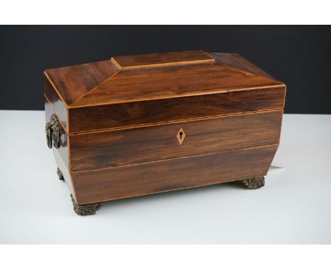 Early 19th century rosewood veneered &amp; satinwood strung sarcophagus tea caddy, with brass foliate feet and handles 