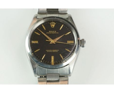 A gents Rolex Oyster Perpetual Superlative Chronometer wristwatch, black dial with gold baton marker, Rolex logo to crown, 19