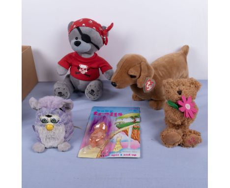 A collection of soft toys including a vintage Furbie