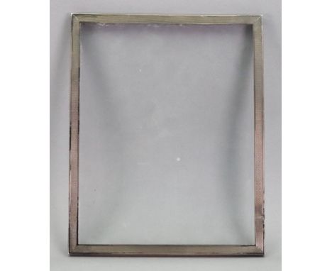 An engine turned rectangular silver photograph frame, Sanders &amp; Mackenzie, Birmingham 1966, sight size 23.5 x 18.5cm.