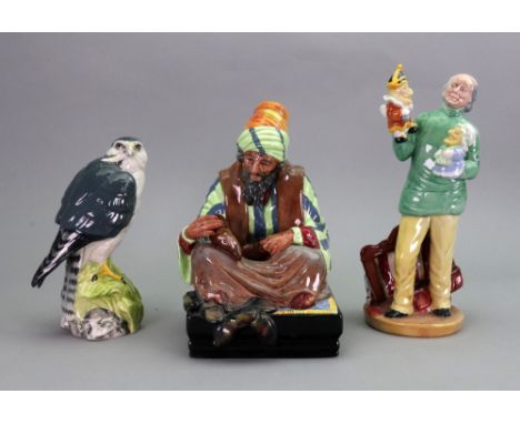 Three Royal Doulton figures, Cobbler HN 1706, Punch and Judy Man HN 2765 and Merlin, Whyte and Mackay Scotch Whisky, Glasgow,