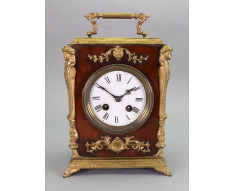 A walnut gilt metal mounted mantel clock, circa 1870, the rectangular case with hinged carrying handle, the white enamel dial