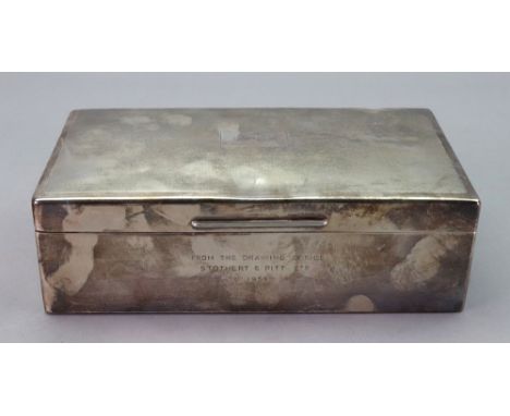 A rectangular silver cigar box, Richard Comyns, London 1946, with engine turned hinged cover, monogrammed and inscribed, 20 x