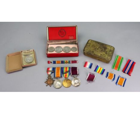 A First World War medal group, 1914 Star, War medal, Victory medal with mention in dispatches and Long Service and Good Condu
